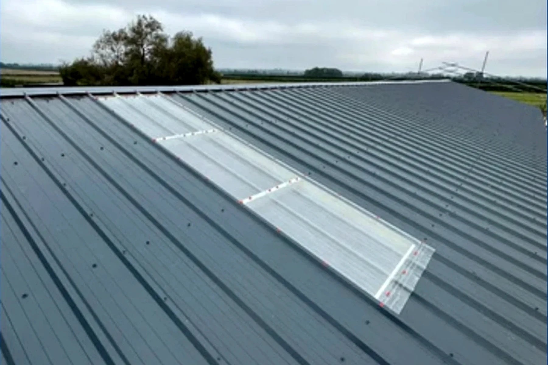Metal roof with fitted rooflights