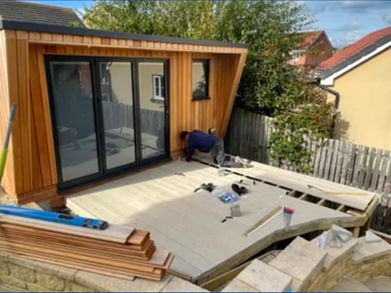 Timber garden room with doors and deck